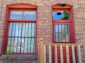 Old fashioned brick building with a barred window and door Royalty Free Stock Photo