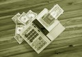 Old fashioned calculator and dollars Royalty Free Stock Photo