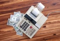 Old fashioned calculator and dollars Royalty Free Stock Photo