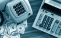 Old fashioned calculator, telephone and dollars Royalty Free Stock Photo