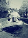 Old fashioned car buried under snow Royalty Free Stock Photo