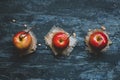 Old fashioned caramel apples with brunch sticks and nuts. Top view Royalty Free Stock Photo