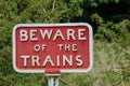 Old fashioned cast iron Beware of Trains sign Royalty Free Stock Photo