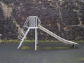 Old fashioned childrens slide, metal. Outdoor play area. No people. Royalty Free Stock Photo