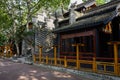 Old-fashioned Chinese buildings by shady street in morning Royalty Free Stock Photo