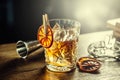 Old fashioned classic cocktail drink in crystal glass on bar counter