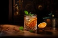 Old Fashioned cocktail glass on table isolated in dark background.