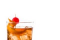 Old fashioned cocktail with orange and cherry isolated. Royalty Free Stock Photo