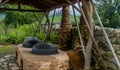 Old fashioned cooking cauldrons in primitive earth oven