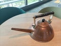 Closeup of an old and antique bronze metal copper teapot Royalty Free Stock Photo