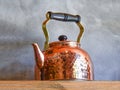 Old fashioned Copper Kettle on shelf. Royalty Free Stock Photo