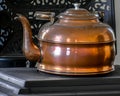 Copper Tea Kettle on Cast Iron Wood Stove Royalty Free Stock Photo