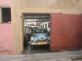 Old fashioned Cuban car in a garage