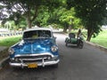 Old fashioned Cuban car and motorcycle