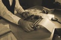 Old fashioned detective working with typewriter at table in office, closeup Royalty Free Stock Photo