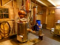 Distillery equipment on display in wooden house Royalty Free Stock Photo