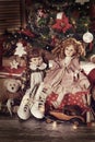 Old-fashioned dolls and toys under Christmas tree Royalty Free Stock Photo