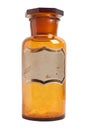 Old fashioned drug bottle with label, isolated.