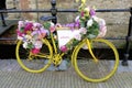 Old-fashioned Dutch city bike near a bridge over canal