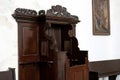 Old fashioned empty confessional in a church closeup architectural detail, nobody, no people Confession, confessing sins religious