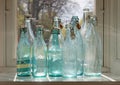 Old Fashioned Empty Glass Bottles In A Window