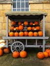 An old-fashioned farmers market stall with pumpkins for sale at Halloween Royalty Free Stock Photo