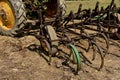 Field cultivator hooked to a tractor hitch