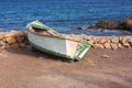 An old-fashioned fishing boat by the sea Royalty Free Stock Photo