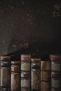 Old fashioned flat lay with stack of antique leather bound books against a dark background Royalty Free Stock Photo