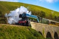 Old-fashioned Flying Scotsman train steaming on the Corfe Viaduct Royalty Free Stock Photo