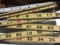 Old fashioned folding rulers on table