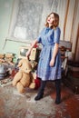 Old fashioned girl with teddy bear