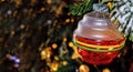 Old fashioned glass Christmas ornament on bokeh tree - close-up - illustration - just add text