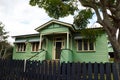 Old fashioned, green painted, suburban home