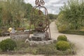 Old fashioned hand water pump in a vegetable garden Royalty Free Stock Photo