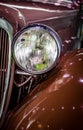 Old fashioned head lamp and fender of an antique automobile