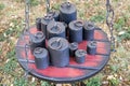 Old-fashioned iron weights on a wooden tray of an old scale Royalty Free Stock Photo