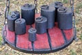 Old-fashioned iron weights on a wooden tray of an old scale Royalty Free Stock Photo