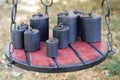 Old-fashioned iron weights on a wooden tray of an old scale Royalty Free Stock Photo