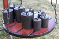 Old-fashioned iron weights on a wooden tray of an old scale Royalty Free Stock Photo