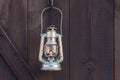 Old fashioned lantern on an wooden wall Royalty Free Stock Photo