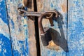 The old-fashioned latch on the door, the old castle, retro style