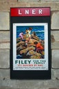 Old fashioned LNER railway advertisement poster for Filey 