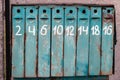 Old fashioned mail box. Row of blue postbox. Letter box with numbers. Retro postal storage. Outdoor mailbox.