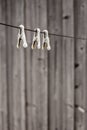 Old-fashioned metal clothespins hanging on the clothesline rope