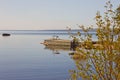 Morning seascape with an old boat and wooden walkways Royalty Free Stock Photo