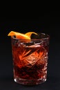 Old fashioned Negroni cocktail on the black background. Royalty Free Stock Photo