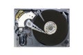 Old fashioned, open, mechanical harddisc drive, isolated on a white background Royalty Free Stock Photo