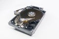 Old fashioned, open, mechanical harddisc drive, isolated on a white background
