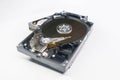 Old fashioned, open, mechanical harddisc drive, isolated on a white background Royalty Free Stock Photo